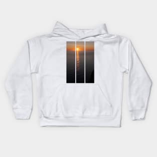 Wonderful landscapes in Norway. Nord-Norge. Beautiful scenery of a midnight sun sunset at Nordkapp (Cape North). Boat and globe on a cliff. Rippled sea and clear orange sky. (vertical) Kids Hoodie